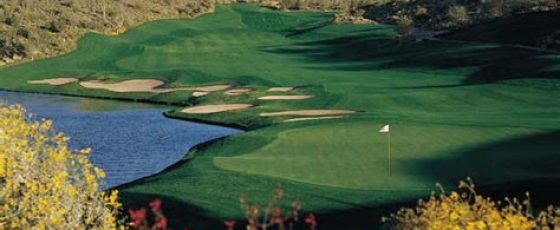 a golf course with a lake